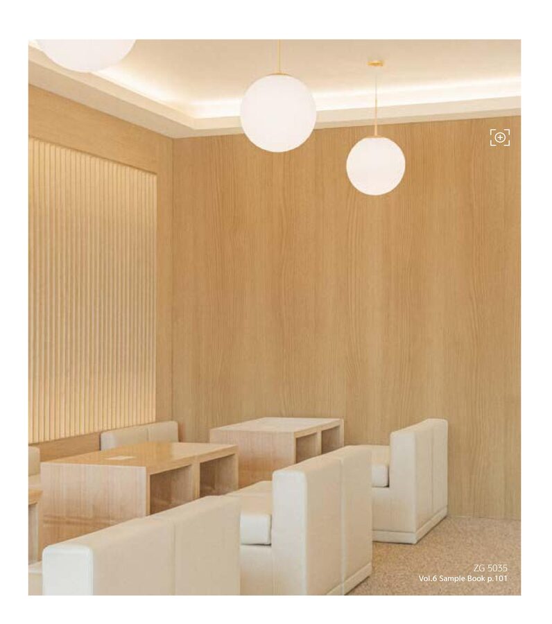 Restaurant bar area with architectural wood grain vinyl film applied to walls and bar counter