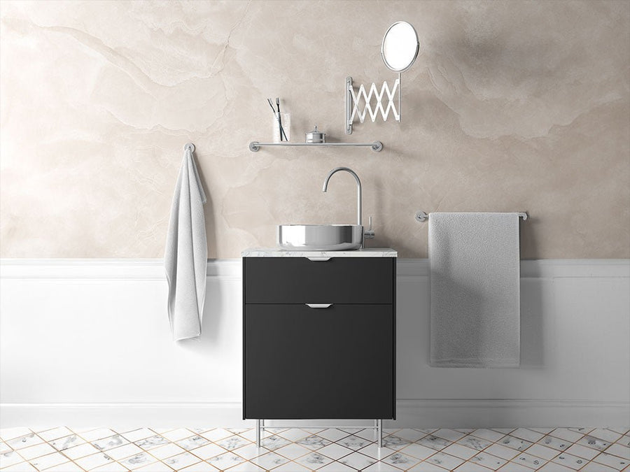 Bathroom vanity unit wrapped with architectural vinyl film showing modern stone effect finish