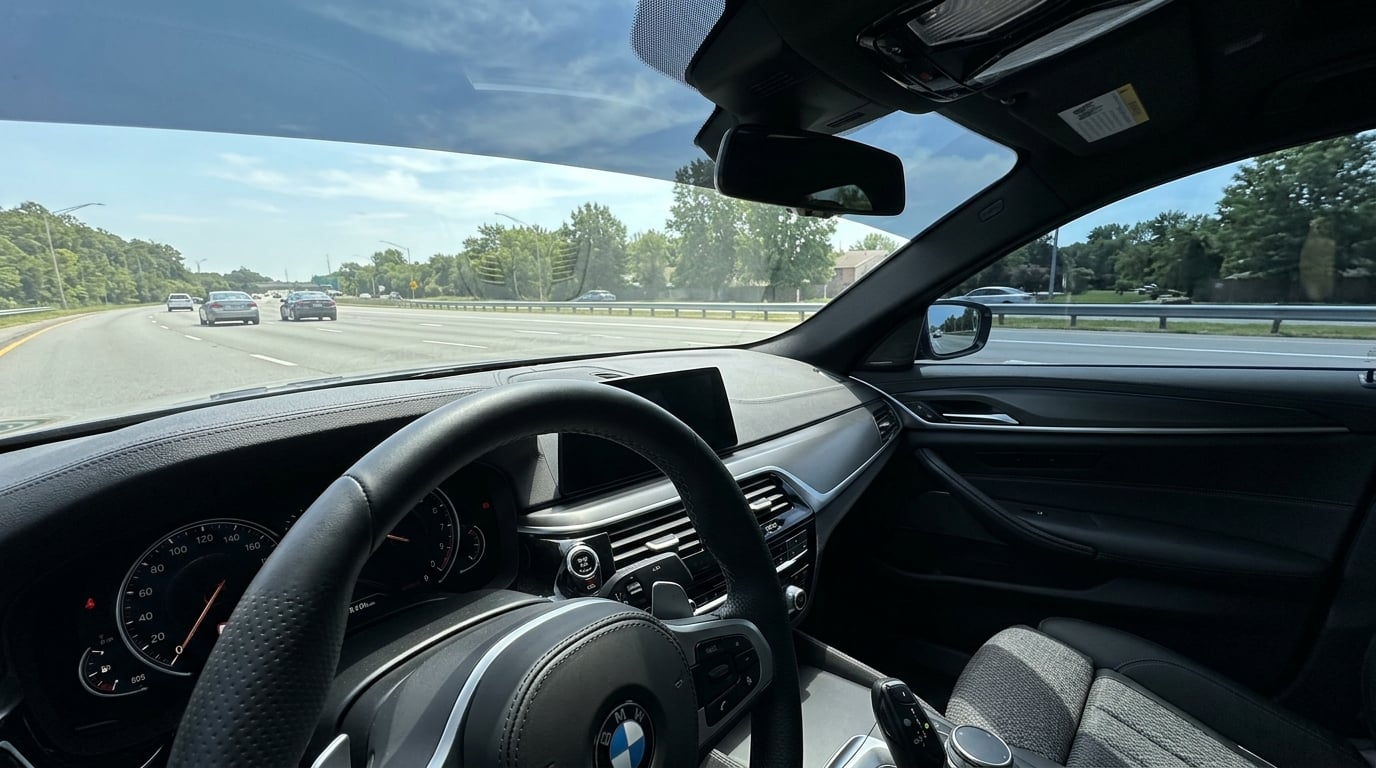 View from inside a car looking out through tinted windows showing reduced glare and a comfortable cabin