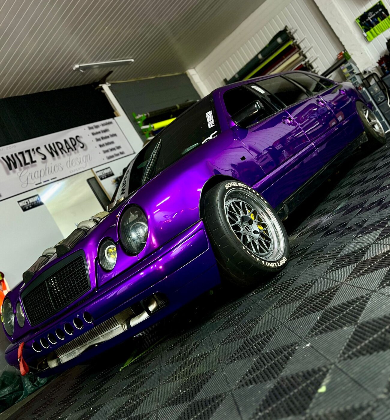 Low angle shot of the purple drift limo showing the modified stance