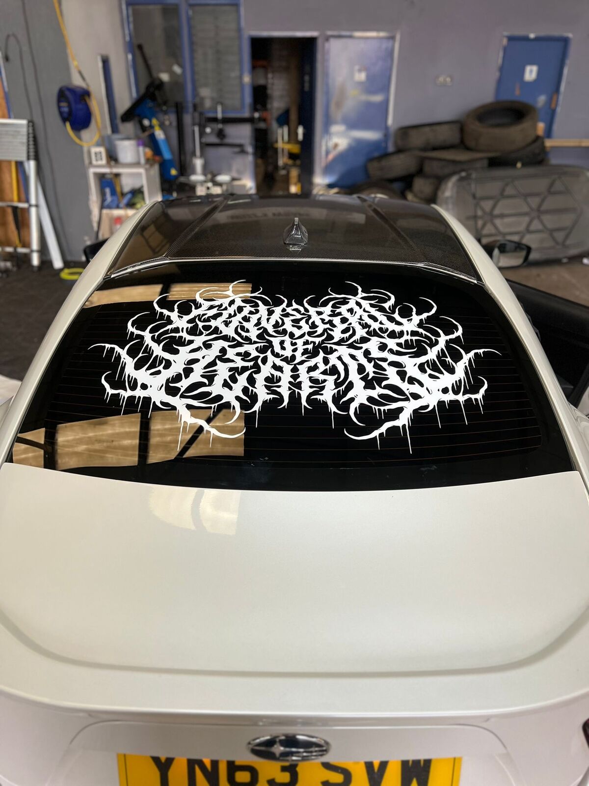 Subaru BRZ rear view showing full custom tattoo graphic vinyl installation by Wizz's Wraps